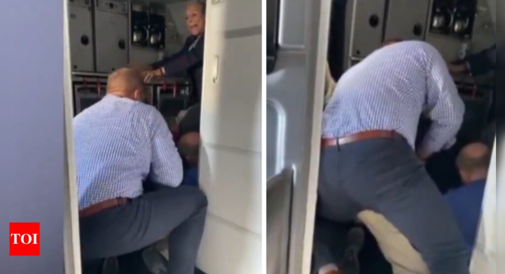 Watch: Passengers duct-tape man who demanded to exit American Airlines flight midair