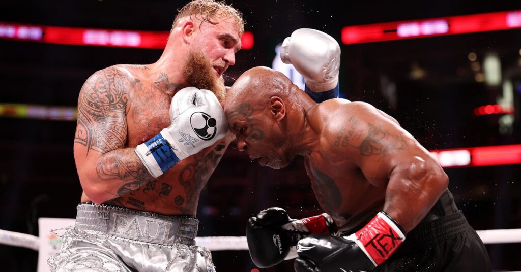 A photo showing Mike Tyson and Jake Paul in the boxing ring