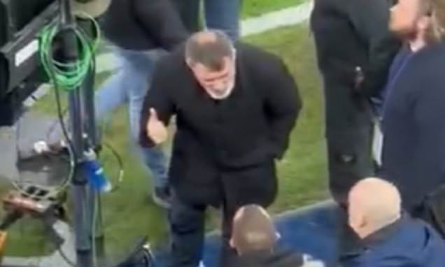 Roy Keane furiously confronts fan who was abusing him following Man United's 1-1 draw at Portman Road... after group of supporters shout 'F*** YOU' at former Ipswich manager