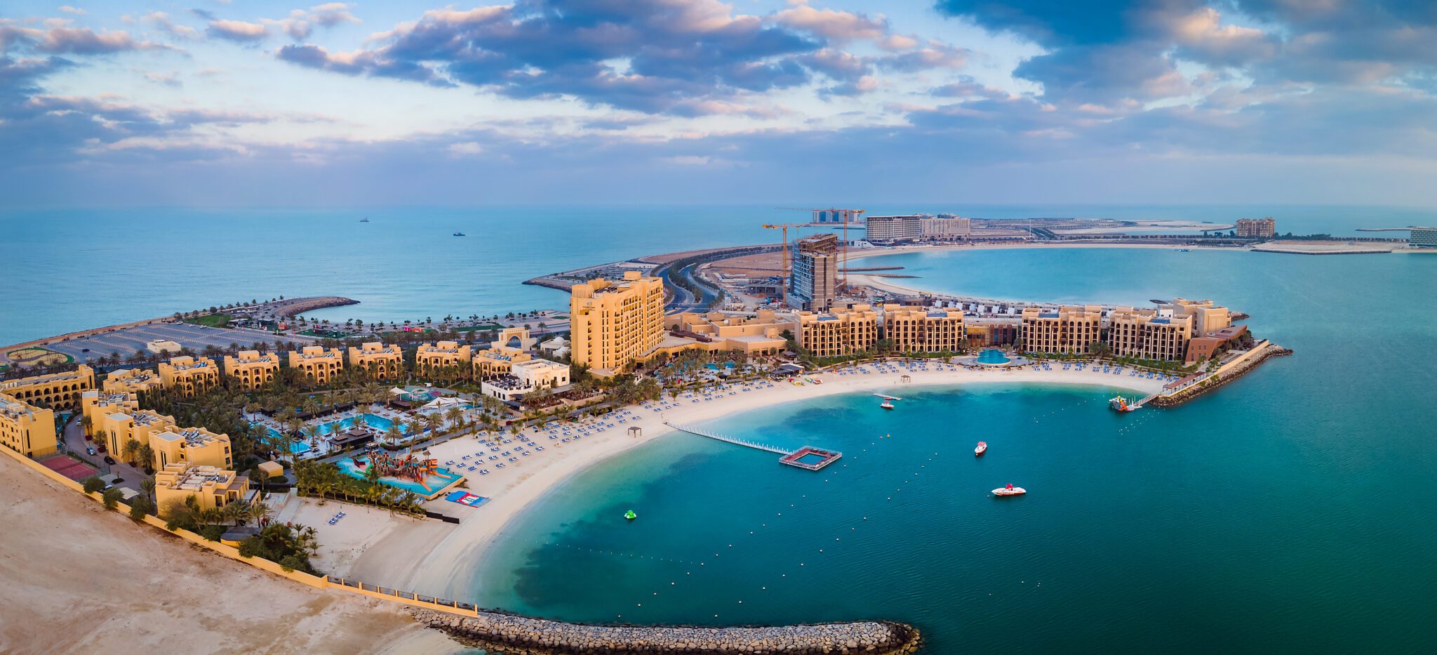 An image of a man-made island with hotels.