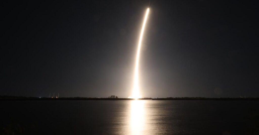 A night time shot of SpaceX’s Falcon 9 rocket launching.