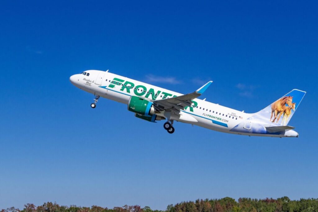 An A320neo from Frontier Airlines takes off from the runway.