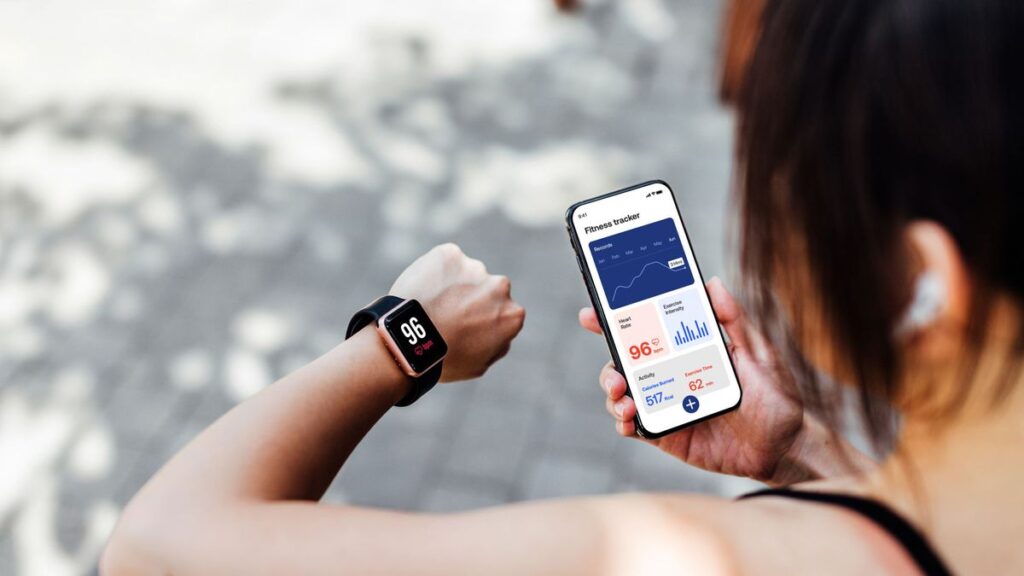 A woman checking her heart rate on a fitness watch