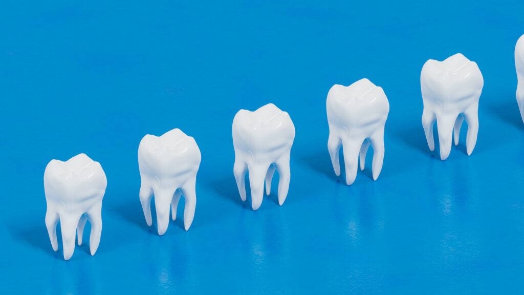 an illustration of repeating teeth on a blue background