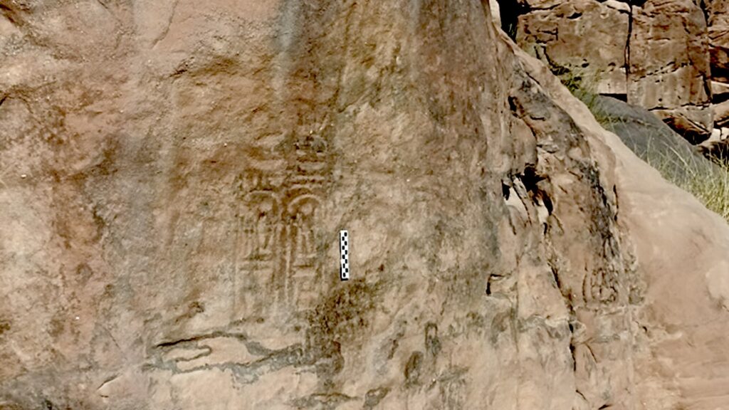 a photo of an inscription on a rock face