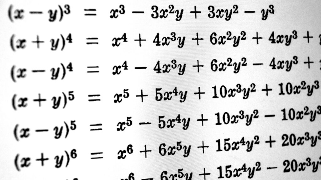 A series of math equations on a screen