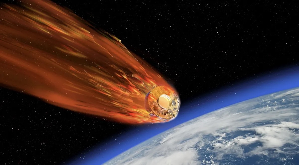 An illustration of a burning satellite hurdling back into Earth's atmosphere